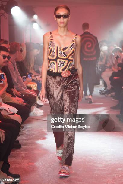 Model walks the runway during the WWWW SSS World Corp Menswear Spring/Summer 2019 show as part of Paris Fashion Week on June 22, 2018 in Paris,...