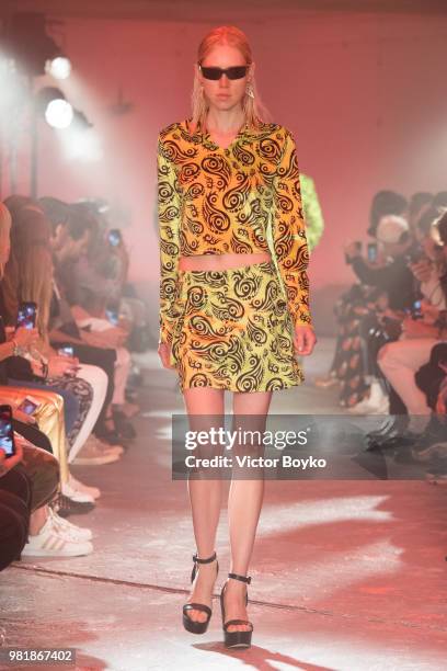 Model walks the runway during the WWWW SSS World Corp Menswear Spring/Summer 2019 show as part of Paris Fashion Week on June 22, 2018 in Paris,...