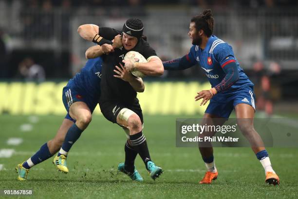 Matt Todd of the All Blacks is tackled during the International Test match between the New Zealand All Blacks and France at Forsyth Barr Stadium on...