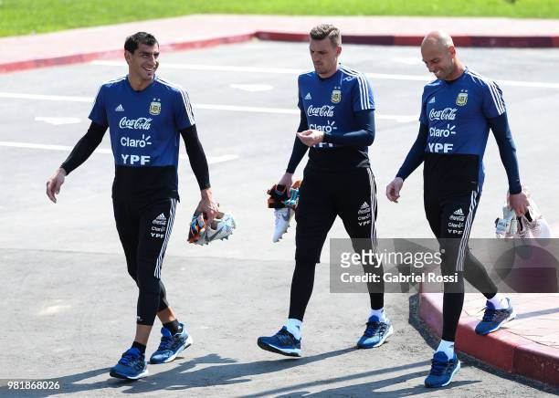 Nahuel Guzman, Franco Armani and Wilfredo Caballero of Argentina arraive prior a training session at Stadium of Syroyezhkin sports school on June 23,...