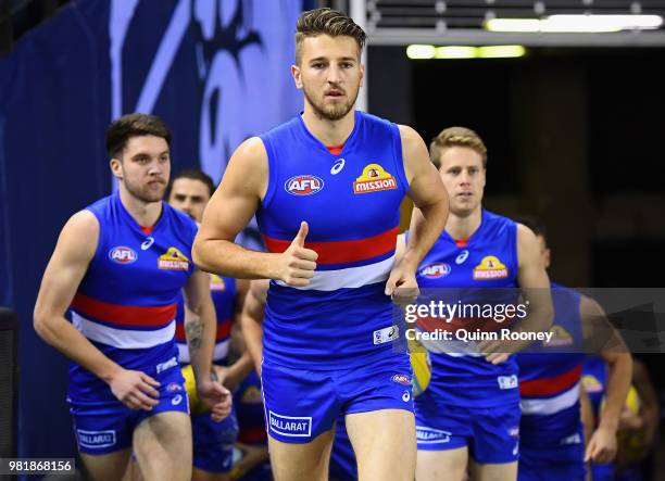 Marcus Bontempelli of the Bulldogs leads his team out onto the field during the round 14 AFL match between the Western Bulldogs and the North...