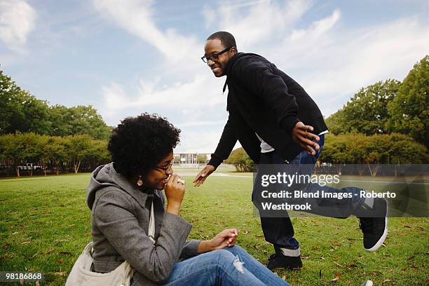 couple playing in park - funny black girl stock pictures, royalty-free photos & images