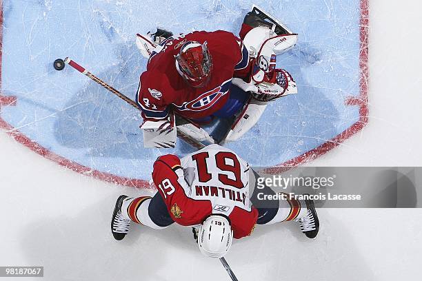 Jaroslav Halak of Montreal Canadiens blocks a shot of Cory Stillman of Florida Panthers during the NHL game on March 25, 2010 at the Bell Center in...