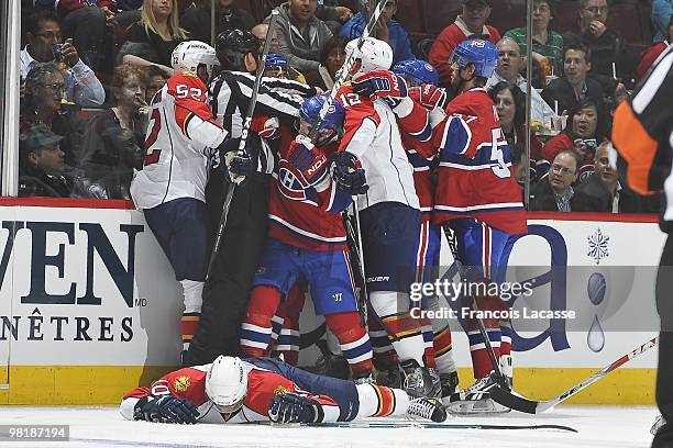 David Booth of Florida Panthers lays on the ice after he was checked by Jaroslav Spacek of Montreal Canadiens during the NHL game on March 25, 2010...