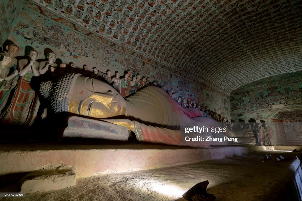 Statue of the final Nirvana of the Buddha.  The Mogao Caves...
