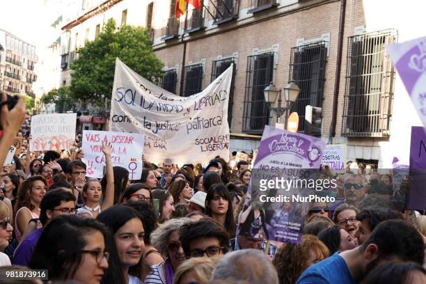 Demonstrators shout slogans and hold placard during a after a court ordered the release on bail of 'La Manada' in Madrid on 22nd June, 2018. The...
