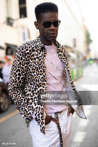 Guest is seen on the street during Paris Men's Fashion Week S/S 2019 wearing animal print jacket with light pink slashed shirt and sneakers on June...