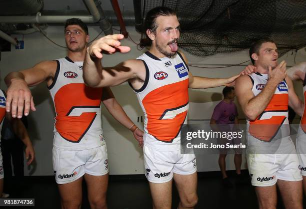 Phil Davis of the Giants celebrates the win with his team during the round 14 AFL match between the Brisbane Lions and the Greater Western Sydney...