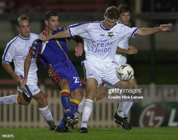 Alex Tobin of the Power is challenged by Craig Foster of the Spirit during the NSL match between the Northern Spirit and the Parramatta Power at...