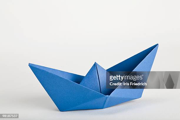 an origami boat - paper boat stock-fotos und bilder