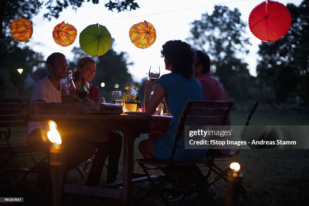 Four people at a dinner party