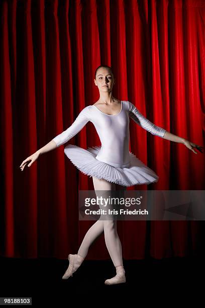 a ballet dancer posing on stage - arts express yourself 2009 stock pictures, royalty-free photos & images