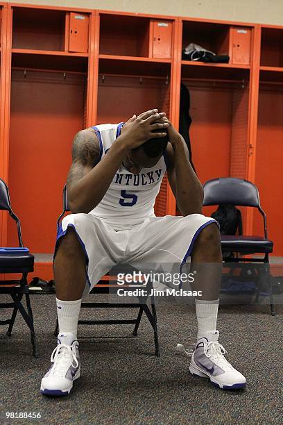 Ramon Harris of the Kentucky Wildcats sits in the locker room dejected after they lost 73-66 against the West Virginia Mountaineers during the east...