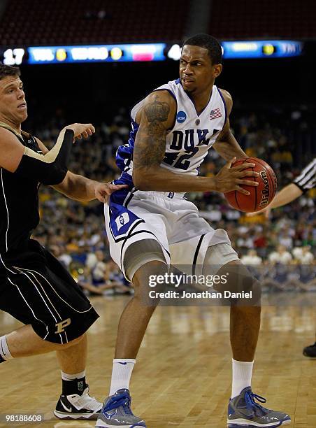 Lance Thomas of the Duke Blue Devils looks to pass against Chris Kramer of the Purdue Boilermakers during the south regional semifinal of the 2010...