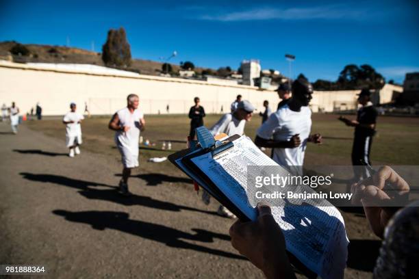 San Quentin Prison, CA Frank Ruona, a former ultra marathon runner and construction company owner, keeps track of runner's times and laps as the San...