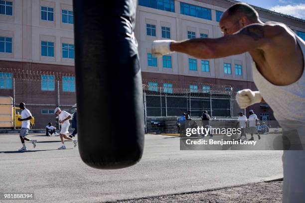 San Quentin Prison, CA While prison marathon runners like Mike Keeyes run 106 laps of the recreation yard, life goes on in the prison, with other...