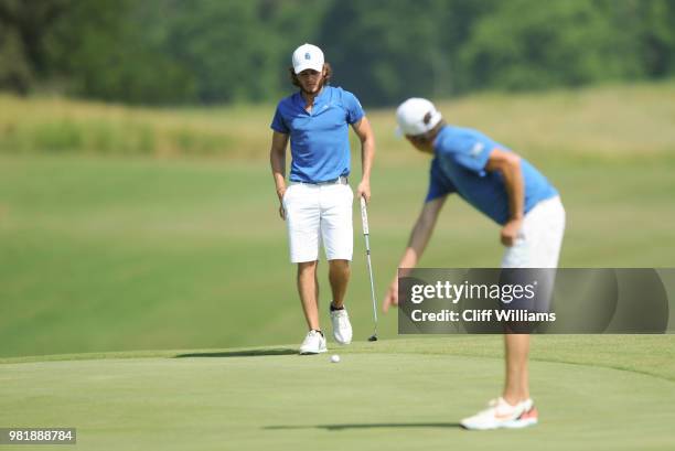 West Florida Coach Steve Fell and West Florida's Carlos Marrero during the Division II Men's Team Match Play Golf Championship held at the Robert...