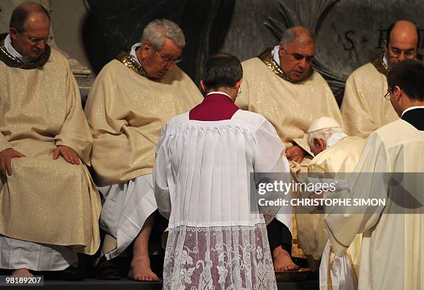 Pope Benedict XVI washes feet during the evening mass of the Lord's Supper on April 01, 2010 in St Giovanni in Laterano Basilica in Rome. Pope...