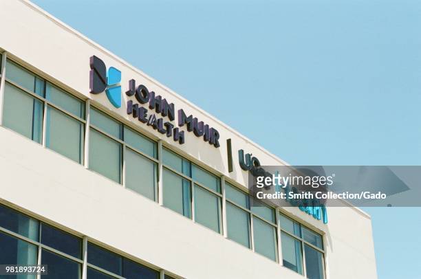 Close-up of logo on facade of combined John Muir health and UCSF health outpatient center, which opened June 2018, in downtown Berkeley, California,...