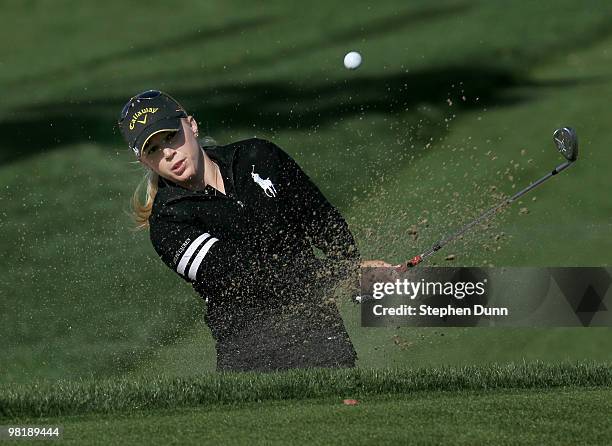 Morgan Pressel hits from a bunker on the 12th hole during the first round of the Kraft Nabisco Championship at Mission Hills Country Club on April 1,...