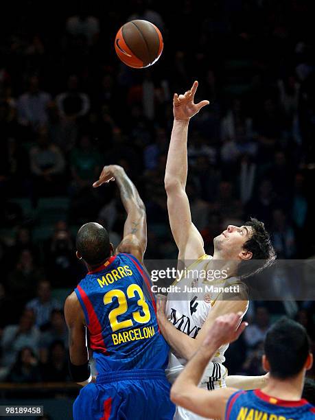 Ante Tomic, #4 of Real Madrid and Terence Morris, #23 of Regal FC Barcelona in action during the Euroleague Basketball 2009-2010 Play Off Game 4...