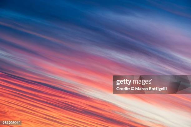 dramatic clouds at sunset - marco bottigelli stock pictures, royalty-free photos & images