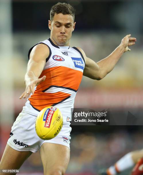 Josh Kelly of the Giants kicks the ball during the round 14 AFL match between the Brisbane Lions and the Greater Western Sydney Giants at The Gabba...
