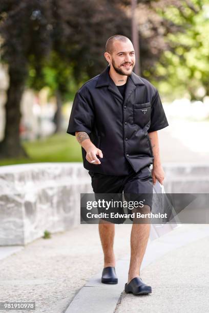 Marc Goehring wears a black jacket, black shorts, outside Cerruti, during Paris Fashion Week - Menswear Spring-Summer 2019 on June 22, 2018 in Paris,...