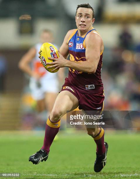 Lewis Taylor of the Lions runs with the ball during the round 14 AFL match between the Brisbane Lions and the Greater Western Sydney Giants at The...