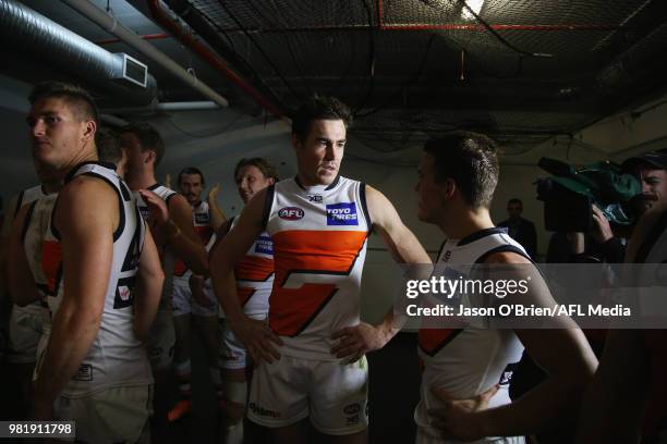 Jeremy Cameron of the Giants talks with team mates after the round 14 AFL match between the Brisbane Lions and the Greater Western Sydney Giants at...