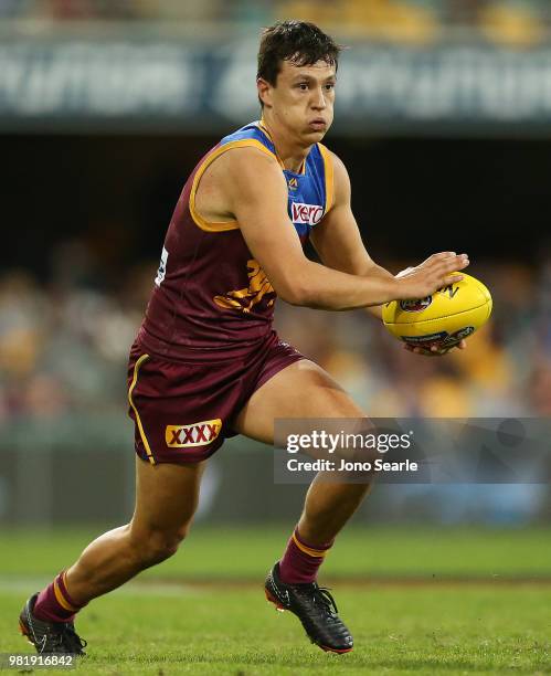 Hugh McCluggage of the Lions runs with the ball during the round 14 AFL match between the Brisbane Lions and the Greater Western Sydney Giants at The...