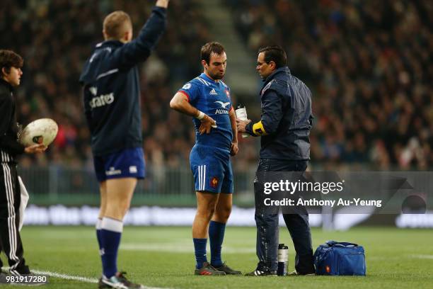 Morgan Parra of France receives medical attention during the International Test match between the New Zealand All Blacks and France at Forsyth Barr...