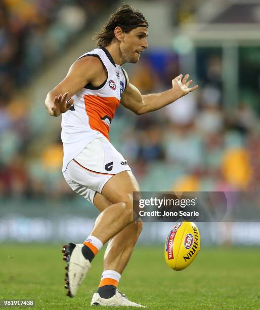 Ryan Griffen of the Giants kicks a goal during the round 14 AFL match between the Brisbane Lions and the Greater Western Sydney Giants at The Gabba...