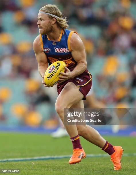 Daniel Rich of the Lions looks to kick during the round 14 AFL match between the Brisbane Lions and the Greater Western Sydney Giants at The Gabba on...