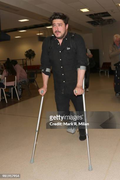 Marcus Mumford arriving at Aberdeen Airport before the wedding of Kit Harrington and Rose Leslie on June 23, 2018 in Aberdeen, Scotland.