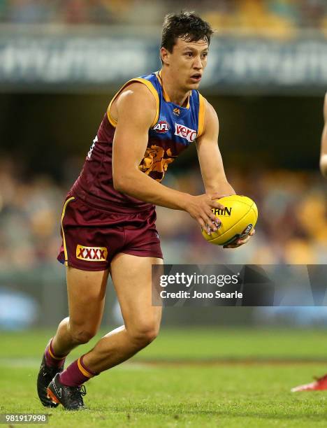 Hugh McCluggage of the Lions runs with the ball during the round 14 AFL match between the Brisbane Lions and the Greater Western Sydney Giants at The...