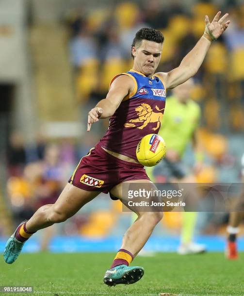 Cameron Rayner of the Lions kicks the ball during the round 14 AFL match between the Brisbane Lions and the Greater Western Sydney Giants at The...