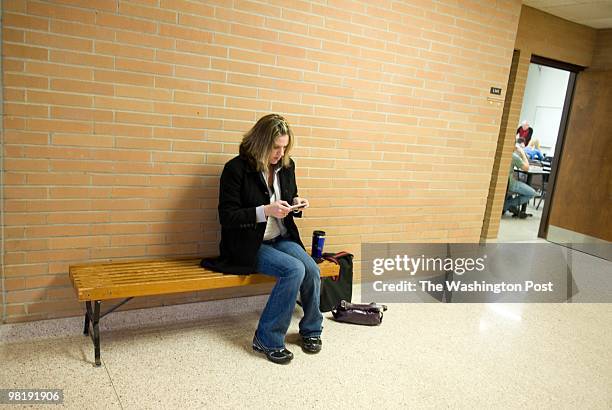 Jennifer Cline of Monroe, is pictured waiting for her community college psychology class to start on March 23, 2010. She is working towards becoming...