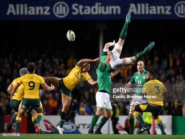 Sydney , Australia - 23 June 2018; Peter OMahony of Ireland falls after being tackled in the air by Israel Folau of Australia during the 2018...