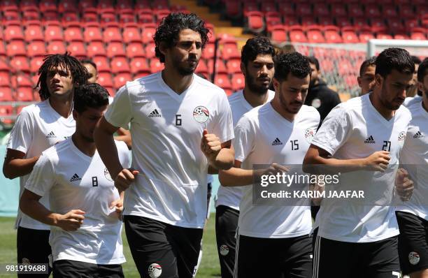 Egypt's defender Ahmed Hegazi, Egypt's defender Mahmoud 'El Winsh' Hamdy and Egypt's forward Mahmoud 'Trezeguet' Hassan jog during a training session...