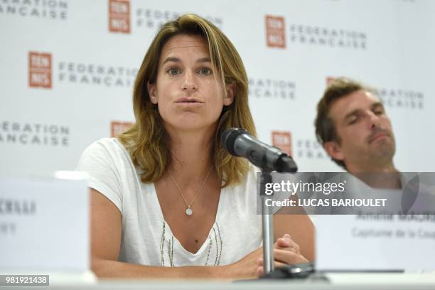 French former world number one Amelie Mauresmo speaks during a press conference after she became the first woman appointed to captain France's Davis...