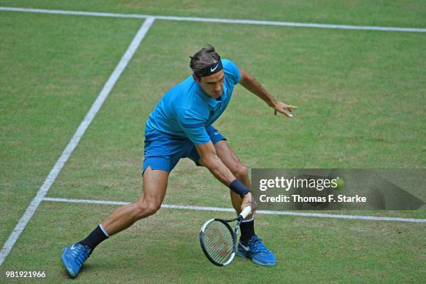 Roger Federer of Switzerland plays a forehand in his half final match against Denis Kudla of the United States during day six of the Gerry Weber Open...