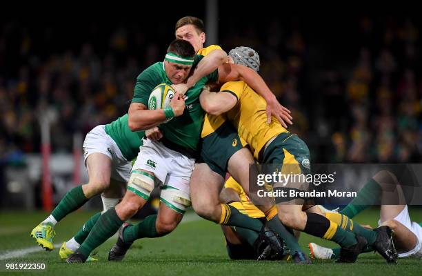 Sydney , Australia - 23 June 2018; CJ Stander of Ireland is tackled by Dane Haylett-Petty, left, and Nick Phipps of Australia during the 2018...