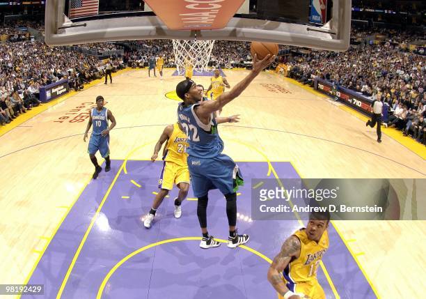 Corey Brewer of the Minnesota Timberwolves shoots a layup against Shannon Brown of the Los Angeles Lakers during the game at Staples Center on March...