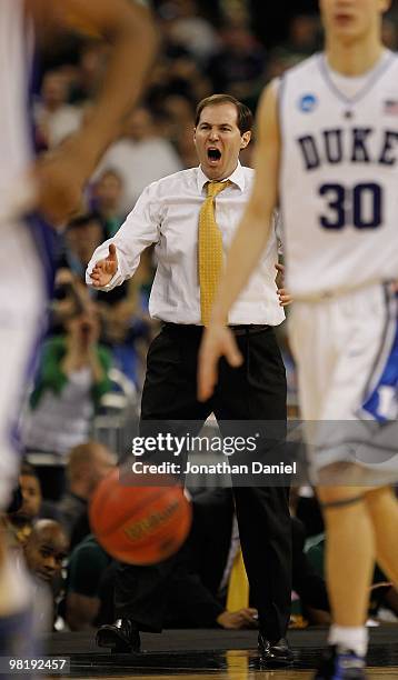 Head coach Scott Drew of the Baylor Bears yells instructions to his team during a game against the Duke Blue Devils in the south regional final of...