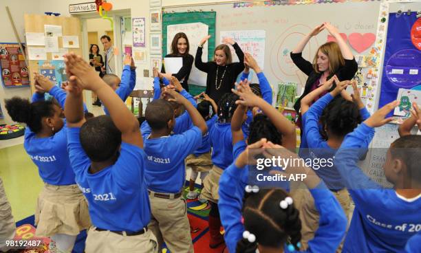 French First Lady Carla Bruni Sarkozy shown with teacher Susan Schaeffler visits at a KIPP school , a school for underprivileged pupils on March 30,...