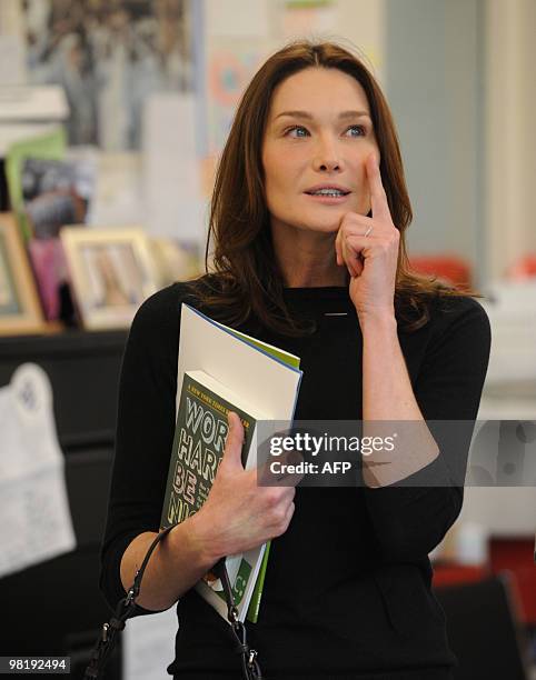 French First Lady Carla Bruni Sarkozy visits at a KIPP school , a school for underprivileged pupils on March 30, 2010 in Washington, DC. AFP...