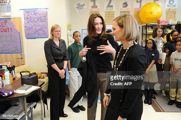 French First Lady Carla Bruni Sarkozy talks with teacher Susan Schaeffer as she visits at a KIPP school , a school for underprivileged pupils on...