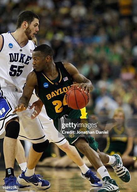 LaceDarius Dunn of the Baylor Bears moves against Brian Zoubek of the Duke Blue Devils during the south regional final of the 2010 NCAA men's...