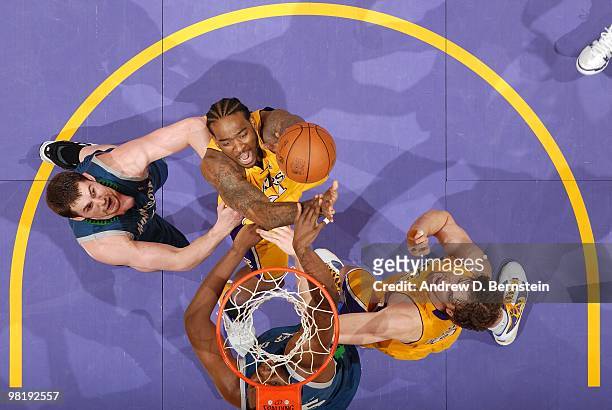Josh Powell of the Los Angeles Lakers puts up a shot against Kevin Love of the Minnesota Timberwolves during the game at Staples Center on March 19,...